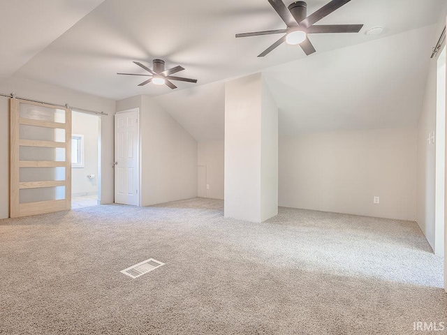 bonus room with carpet floors, ceiling fan, and lofted ceiling