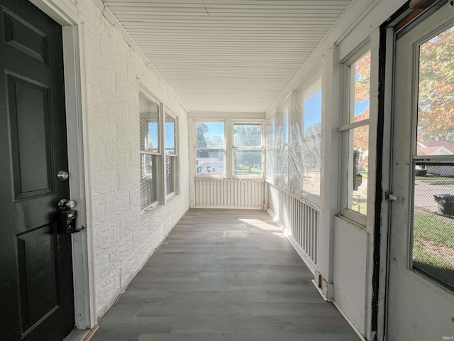 unfurnished sunroom featuring a healthy amount of sunlight