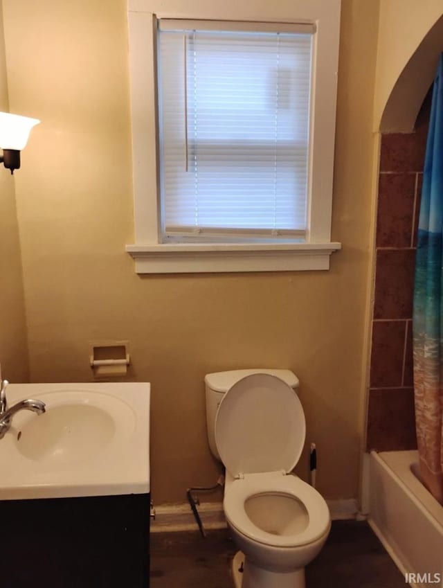 full bathroom with vanity, toilet, and shower / bathtub combination with curtain