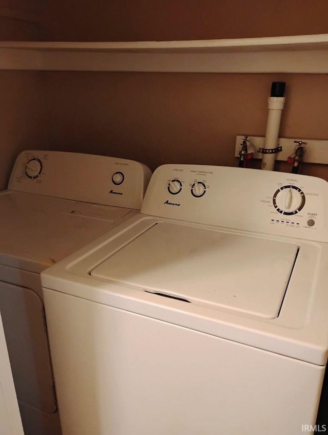 laundry area with separate washer and dryer