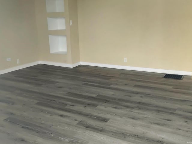 spare room with hardwood / wood-style flooring