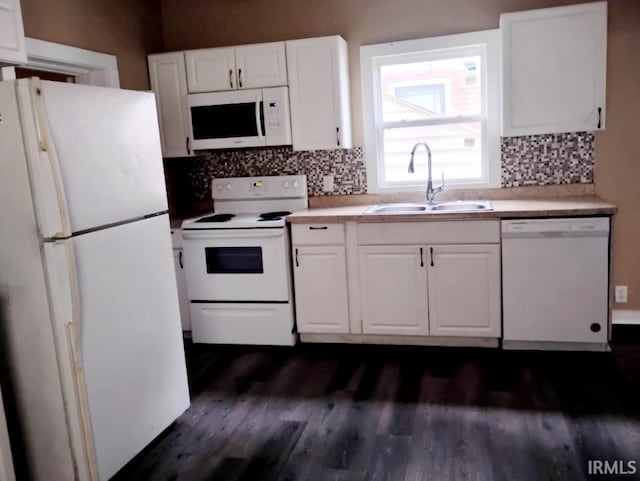 kitchen featuring white cabinetry, sink, dark hardwood / wood-style floors, and white appliances