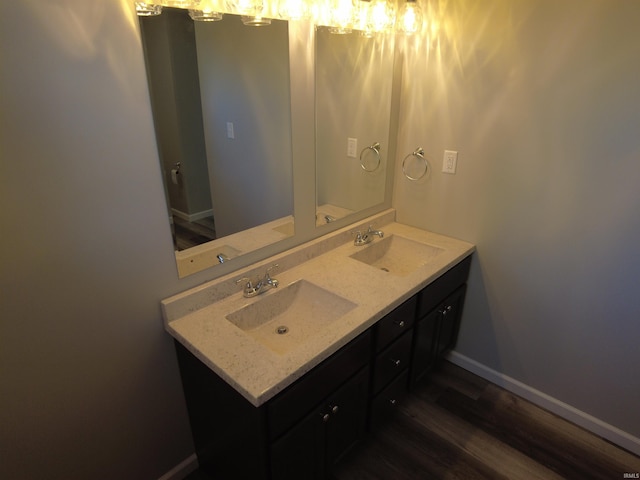 bathroom with vanity and hardwood / wood-style flooring