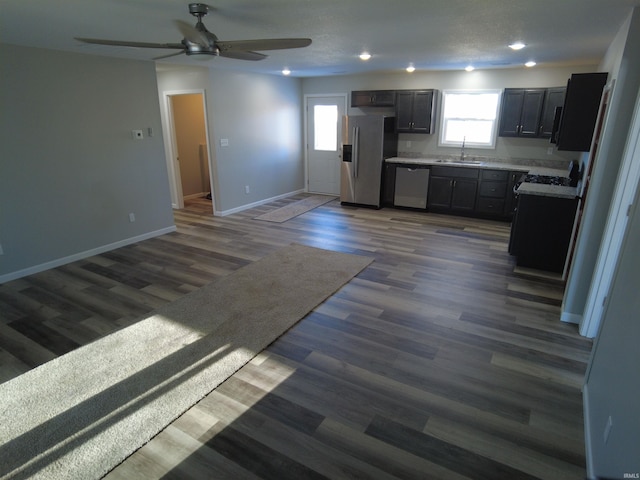 kitchen with ceiling fan, sink, dark hardwood / wood-style floors, and appliances with stainless steel finishes