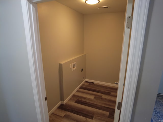 washroom with hookup for a washing machine, dark hardwood / wood-style floors, and hookup for an electric dryer