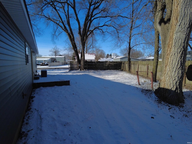 view of yard covered in snow