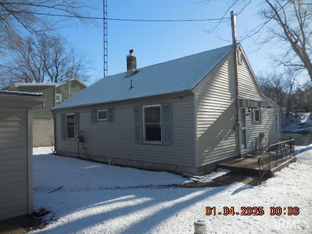 view of snow covered house