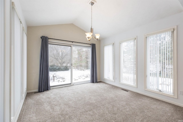 unfurnished room featuring carpet floors, lofted ceiling, and a notable chandelier