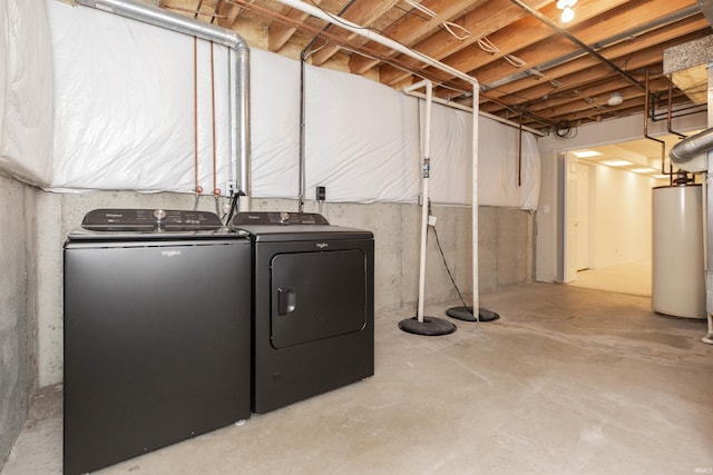 basement with washer and dryer and water heater