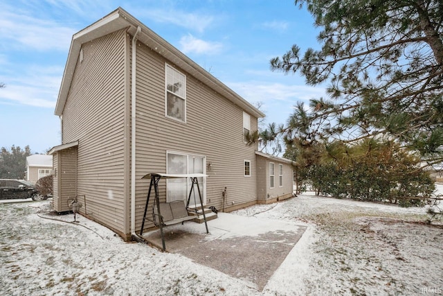 view of snow covered house