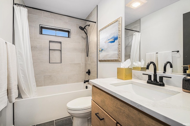 full bathroom with tile patterned floors, shower / bath combo, toilet, and vanity