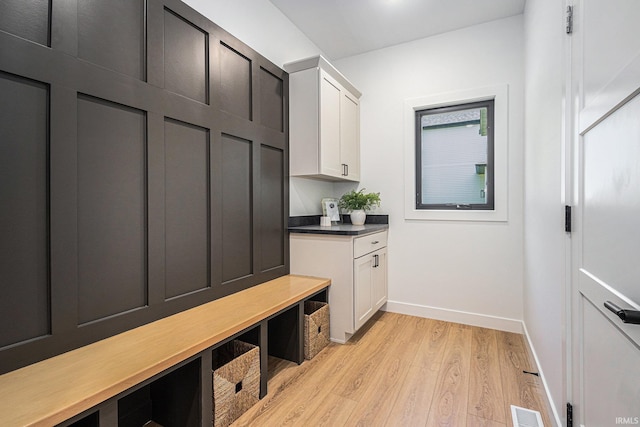 mudroom with light hardwood / wood-style flooring