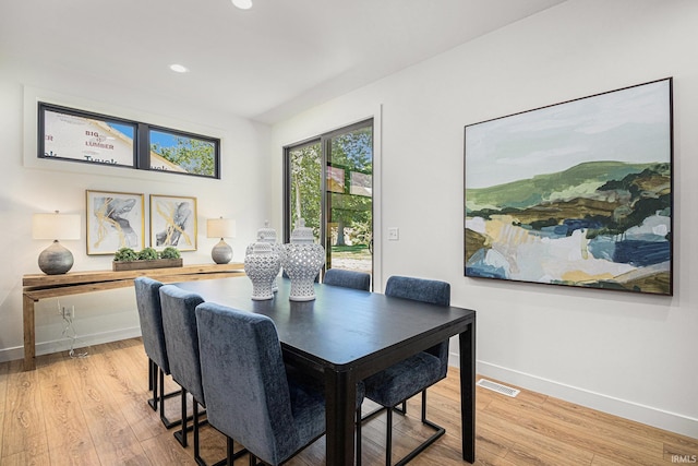 dining room featuring light hardwood / wood-style flooring