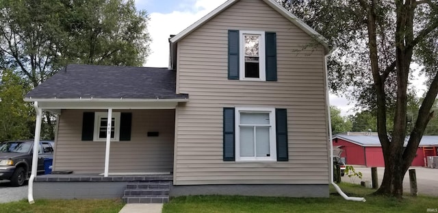 view of front facade with a shingled roof