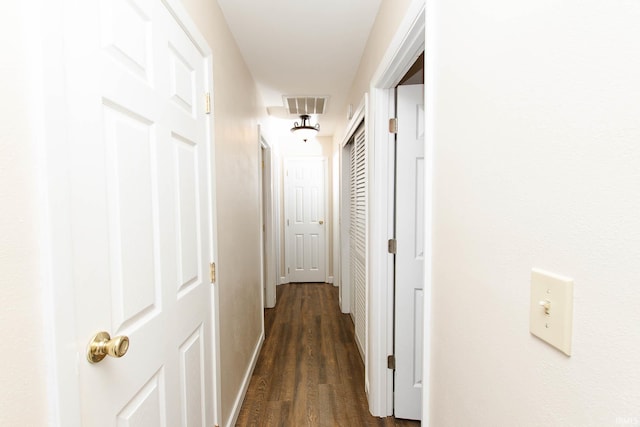 hallway featuring dark hardwood / wood-style flooring