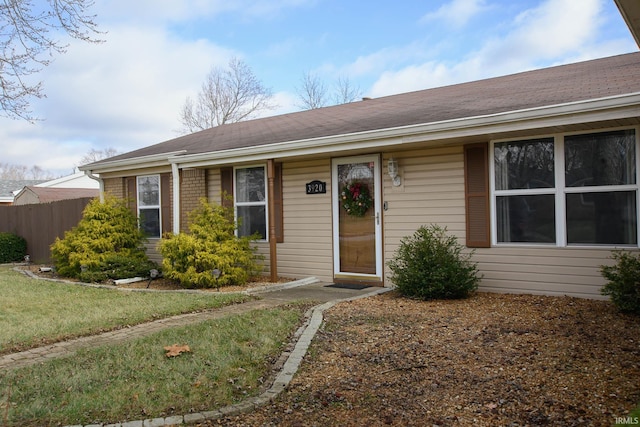 ranch-style house with a front lawn