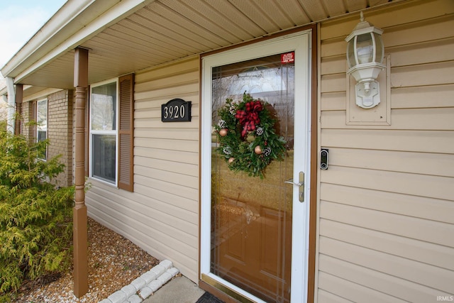 doorway to property featuring a porch