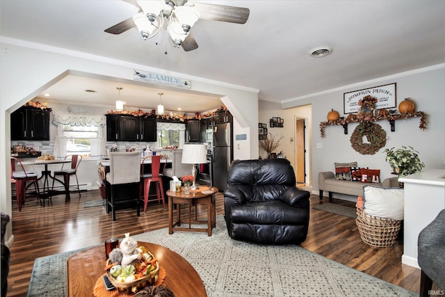 living room with ceiling fan, dark hardwood / wood-style floors, and ornamental molding