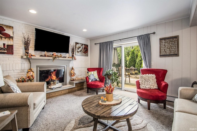 carpeted living room with ornamental molding and a baseboard heating unit