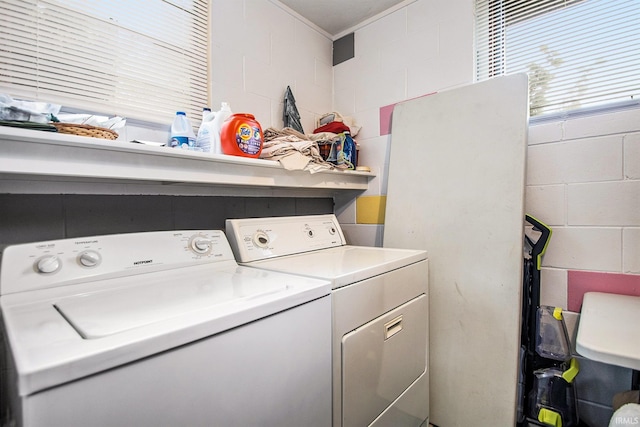 laundry area with washing machine and clothes dryer