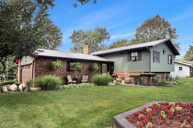 view of front facade with a front lawn and a garage