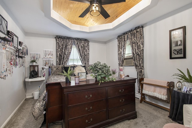 bedroom featuring light colored carpet, a raised ceiling, ceiling fan, and wood ceiling