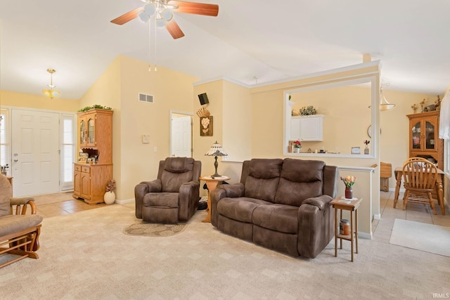 living room featuring ceiling fan, light colored carpet, and vaulted ceiling