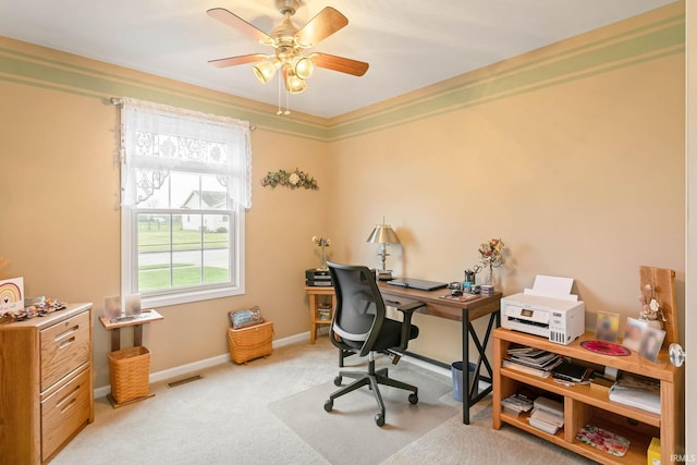 carpeted home office with ceiling fan