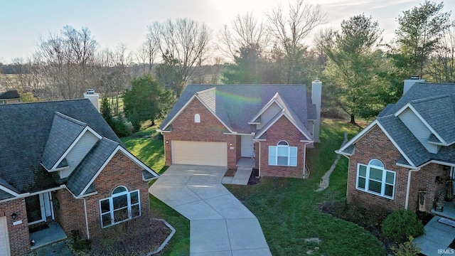 view of front facade with a front yard and a garage