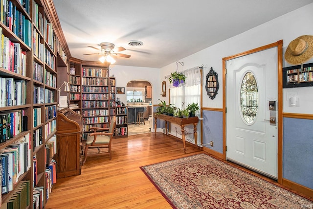 foyer featuring light hardwood / wood-style floors and ceiling fan