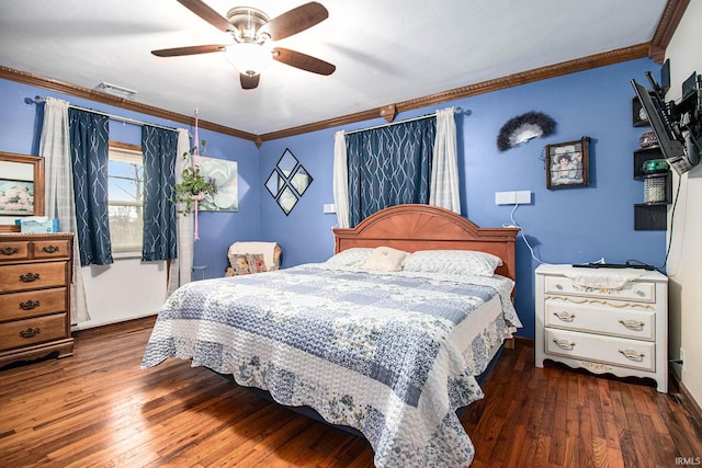 bedroom featuring ceiling fan, crown molding, and dark wood-type flooring