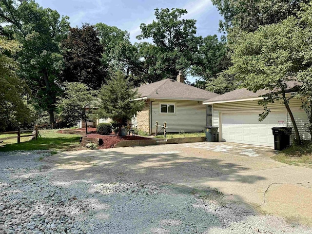 ranch-style home featuring a garage