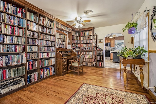 sitting room with ceiling fan and light hardwood / wood-style floors