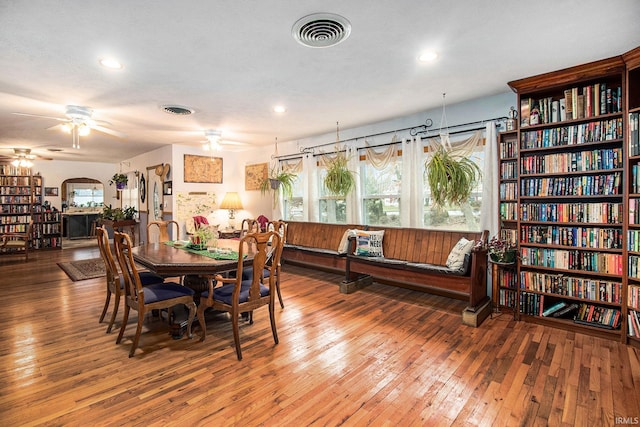 dining room featuring a wealth of natural light, hardwood / wood-style floors, and ceiling fan