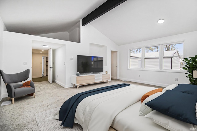 bedroom featuring light carpet and lofted ceiling with beams