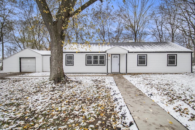 ranch-style house with an outbuilding and a garage