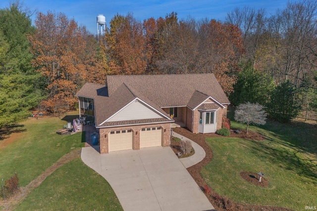 view of front of house featuring a garage and a front lawn