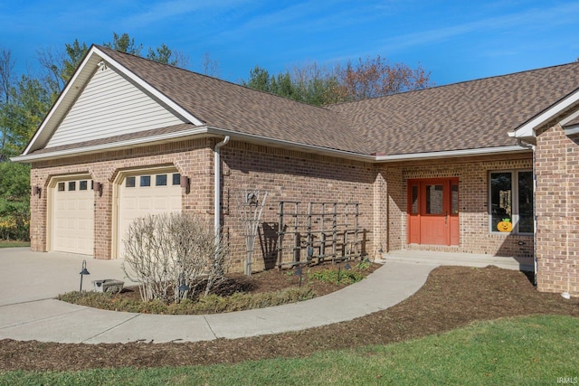 view of side of home featuring a garage