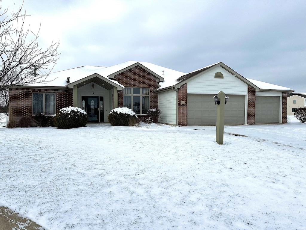 ranch-style home featuring brick siding