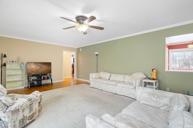 living room with ceiling fan, crown molding, and hardwood / wood-style flooring