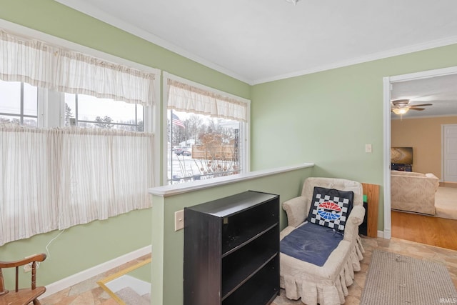 sitting room featuring ceiling fan and ornamental molding