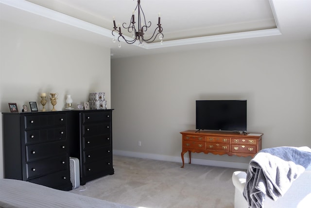 carpeted bedroom featuring a tray ceiling, an inviting chandelier, and ornamental molding