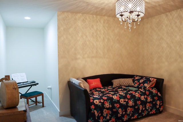 bedroom with carpet floors and an inviting chandelier