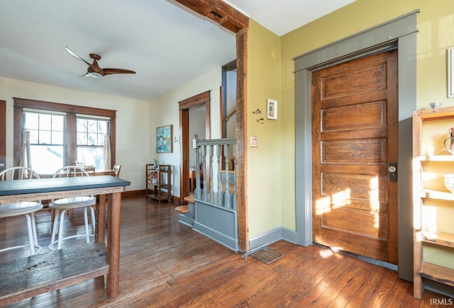 interior space with ceiling fan and dark hardwood / wood-style floors