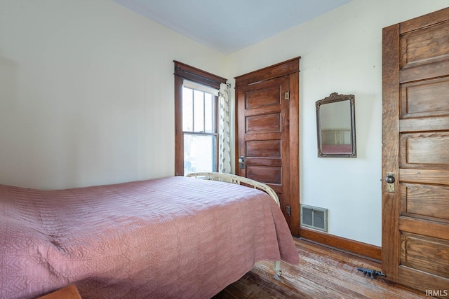 bedroom featuring light hardwood / wood-style floors