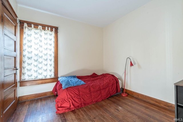 bedroom featuring dark hardwood / wood-style floors