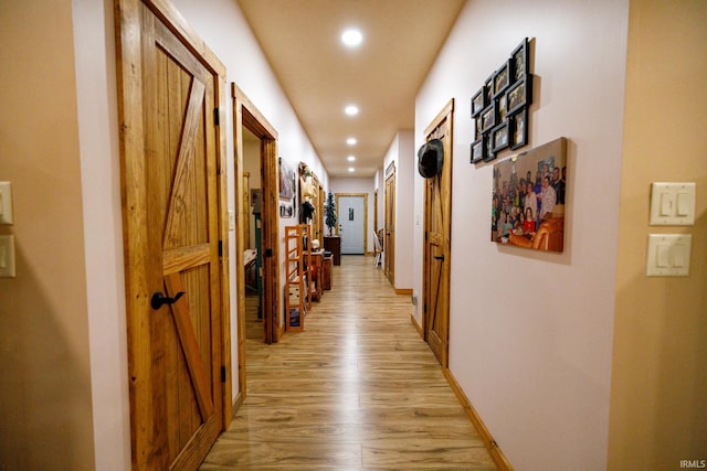 corridor featuring light hardwood / wood-style flooring