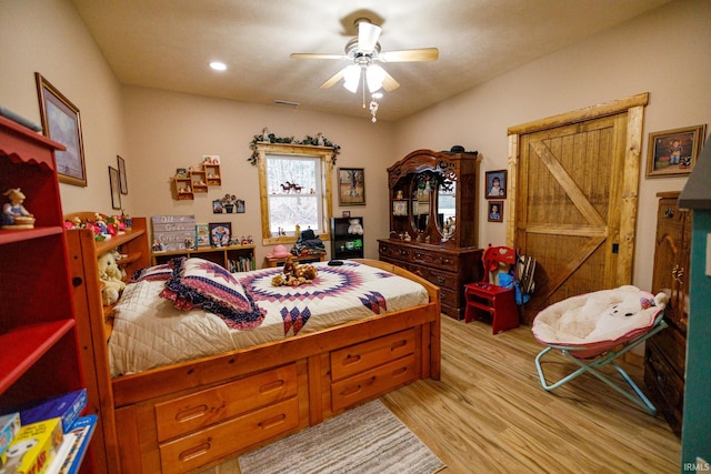 bedroom featuring ceiling fan and light wood-type flooring