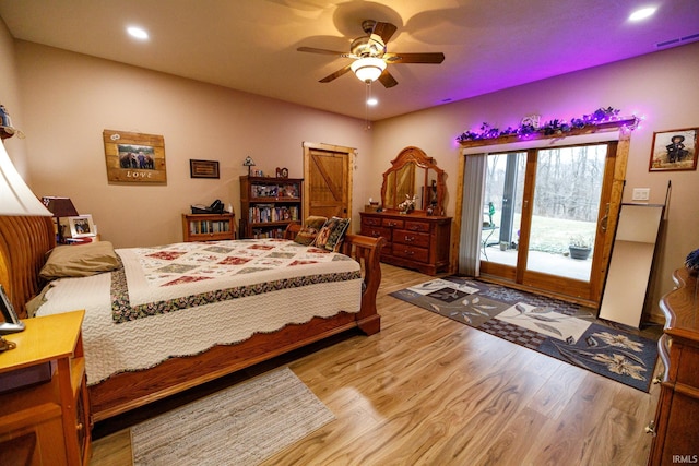 bedroom featuring access to outside, ceiling fan, and light hardwood / wood-style flooring