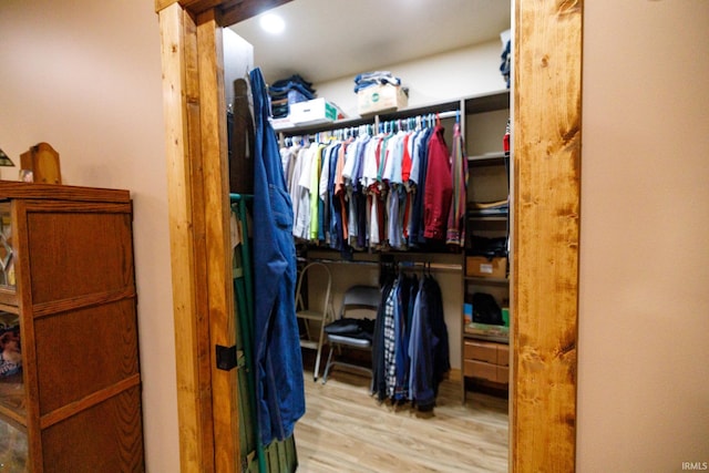 spacious closet with light hardwood / wood-style floors